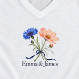 Illustrative printed jersey fabric detail of one white personalized V-neck tee. Emma & James are examples; printed flowers are fixed; props not included.