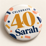 Illustrative glossy printed face detail of one 2.25 inch birthday pin button. Sarah and 40 are personalized examples; clothing, bags, wrapping and props not included.