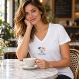 Illustrative adult wearing cafe scene of one white personalized V-neck tee. Emma & James are examples; printed flowers are fixed; props not included.